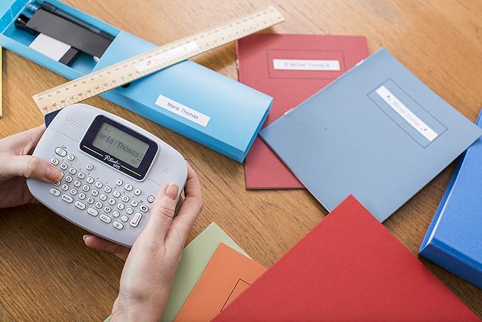 Brother PT-M95 Label Maker, P-Touch Label Printer, Handheld, QWERTY Keyboard, Up to 12mm Labels, Includes Black on White Tape Cassette
